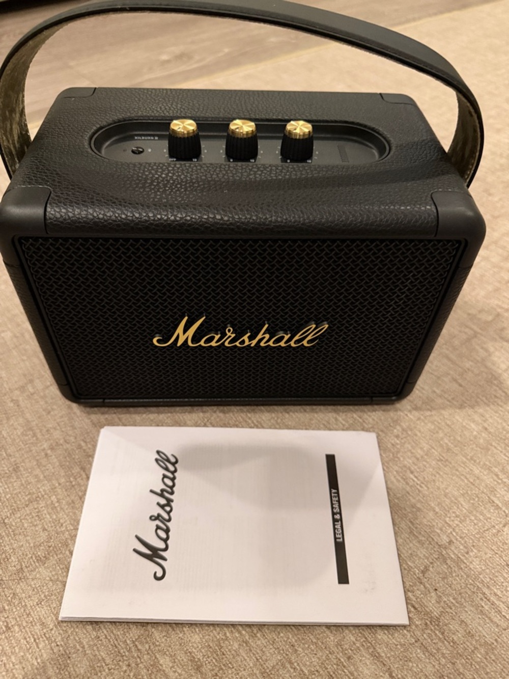 Marshall Black Portable Speaker with Gold Accents and Carry Strap